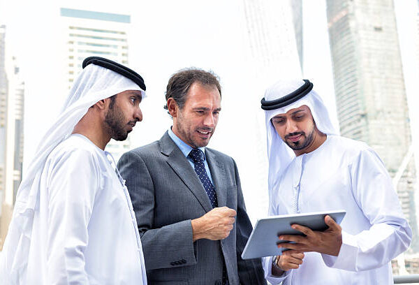 Middle eastern businessmen meeting western man. iStockalypse Dubai - UAE 2015