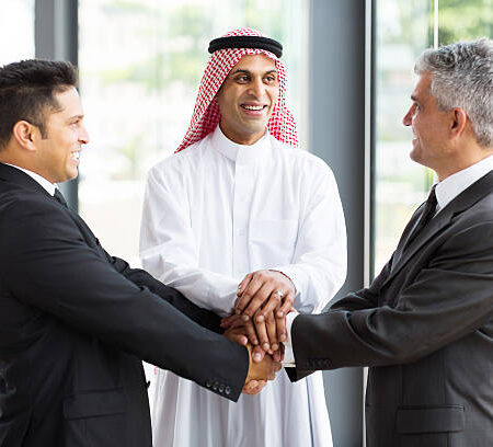 successful multicultural global business team hands together