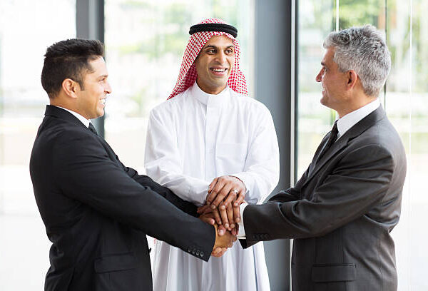 successful multicultural global business team hands together