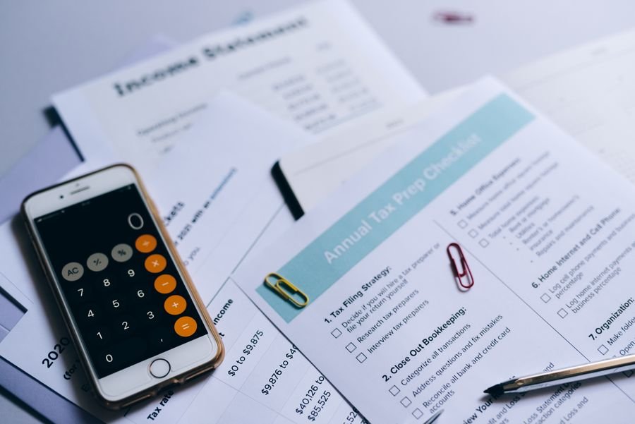 Income statement and financial documents with a calculator