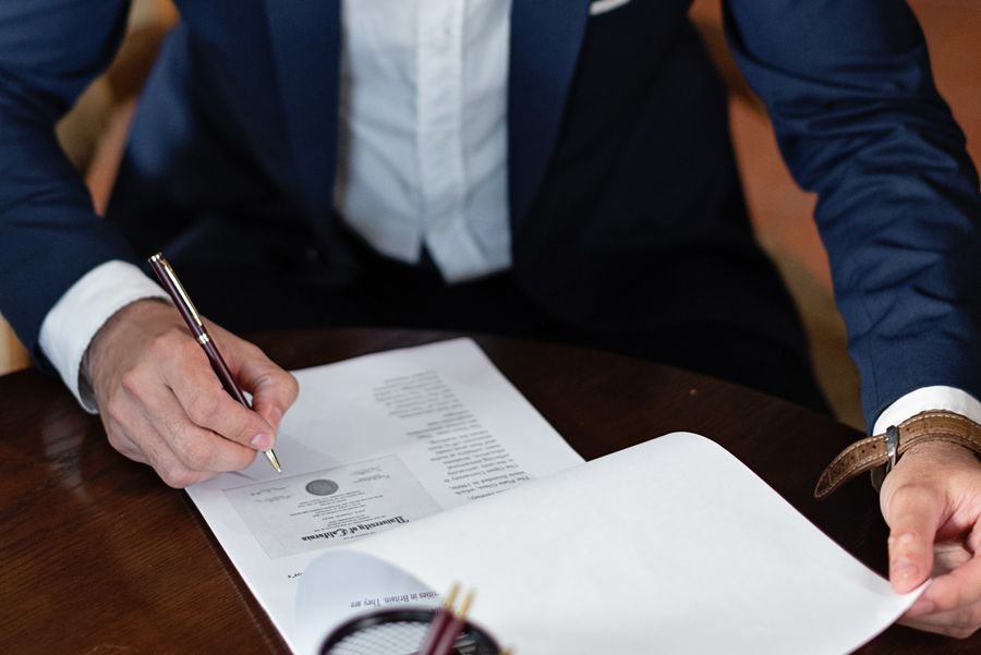 Businessman signing official documents